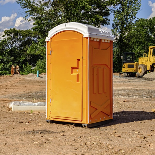 what is the cost difference between standard and deluxe portable restroom rentals in Tekamah